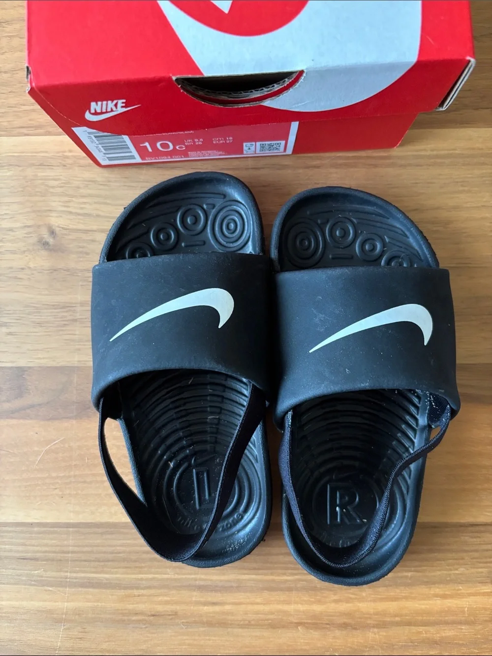 Nike Kids Black Slide Sandals with White Swoosh and Heel Strap